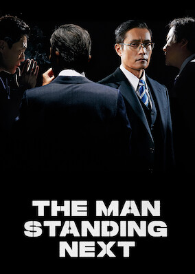 The Man Standing Next